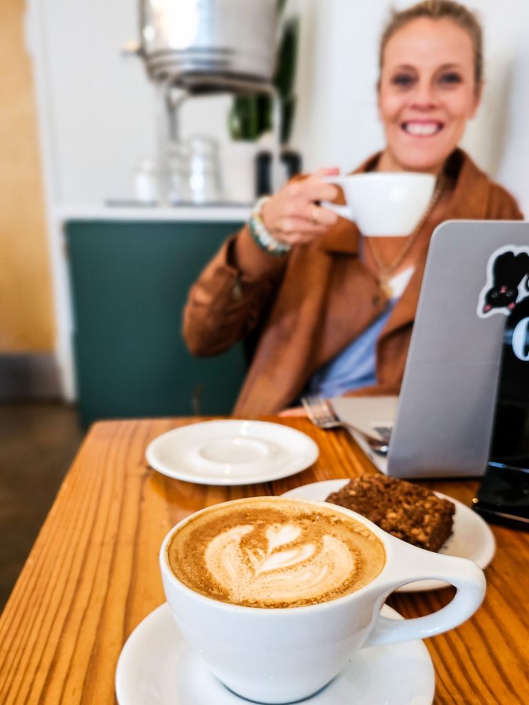Woman drinking coffee in a coffee shop.
