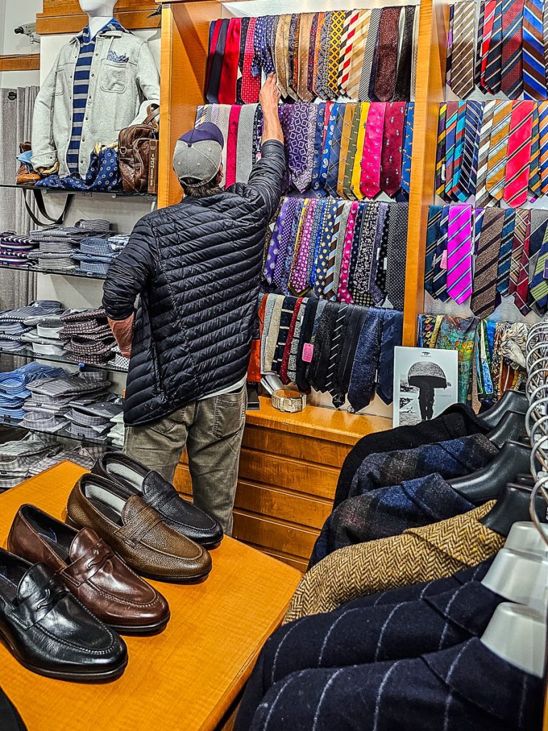 Man shopping for clothes inside a store.