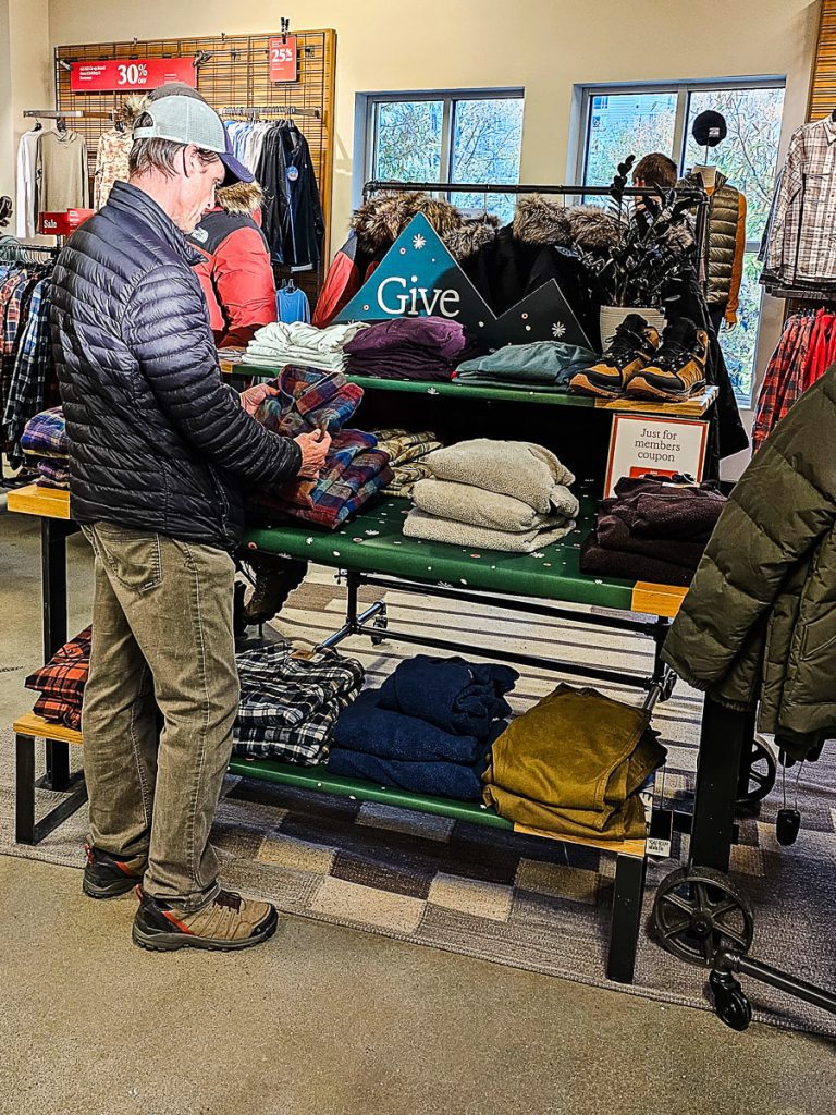 Man shopping for clothes in a store.