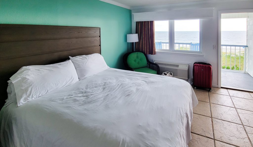 double bed in hotel room with beach views