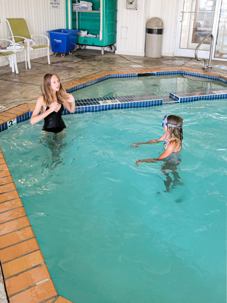 two girls in indoor swimming pool